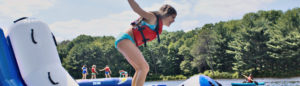 camper playing on the lake