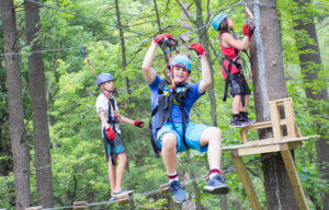 campers playing on the high ropes course