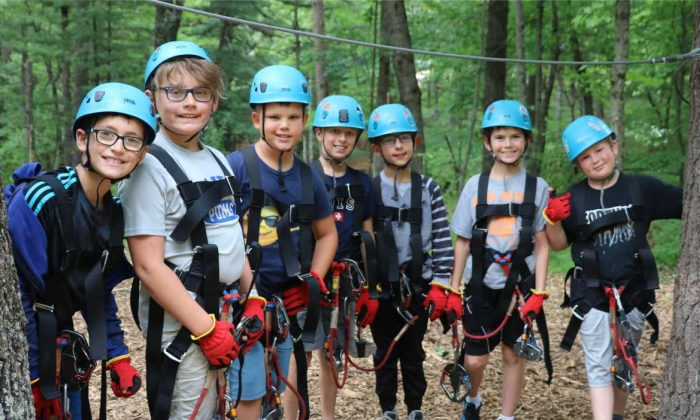 campers wearing their climbing gear at the ropes course