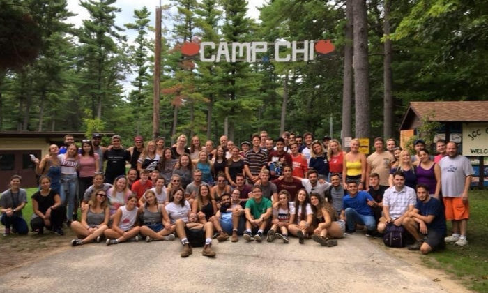 group picture under the Camp Chi sign