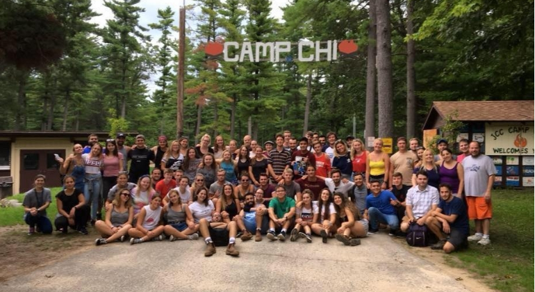 group picture under the Camp Chi sign