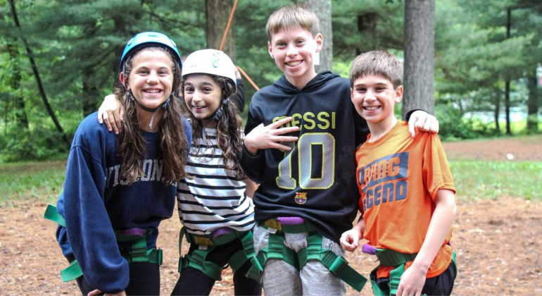 campers dressed in climbing gear
