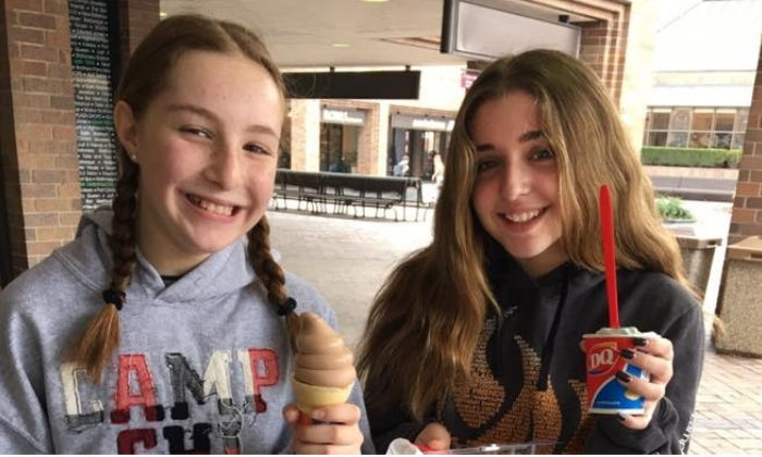 two girls holding dairy queen ice cream