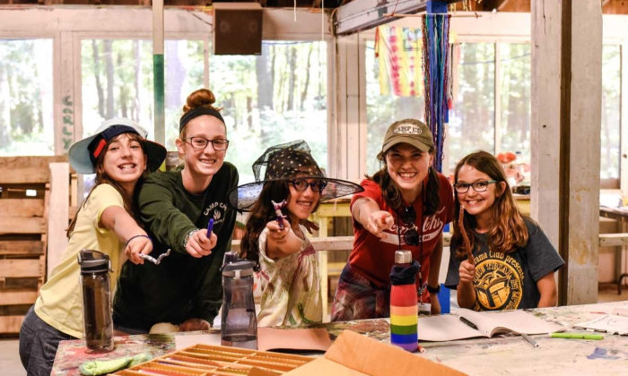campers showing off their painted wands