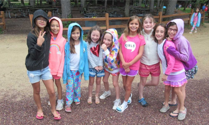 group of campers smiling for the camera