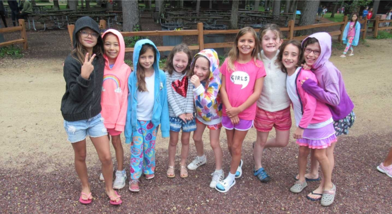 group of campers smiling for the camera