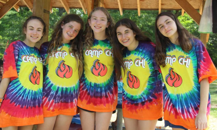 group of girls wearing matching tie dye Camp Chi shirts