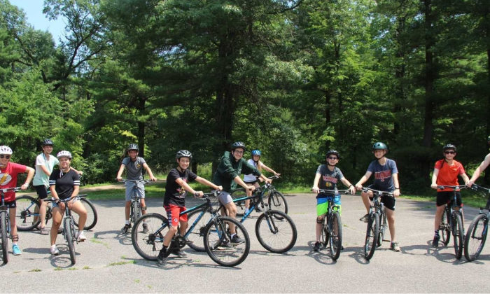 campers riding mountain bikes
