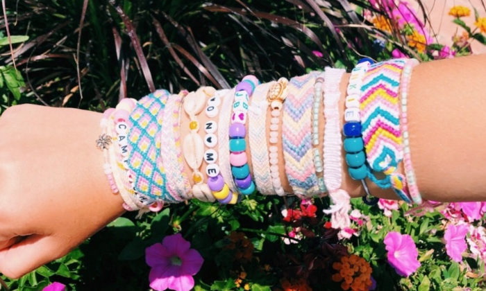 girl with a ton of friendship bracelets