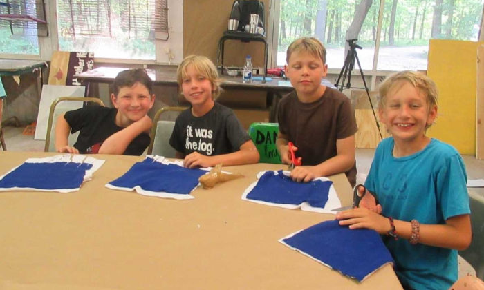 boy campers making crafts