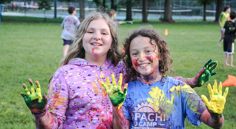 campers covered in paint after a fun evening program
