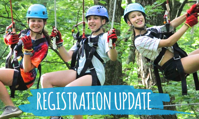 campers smiling on ropes course
