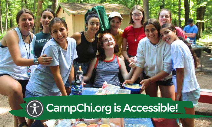 campers posing with friend in wheelchair
