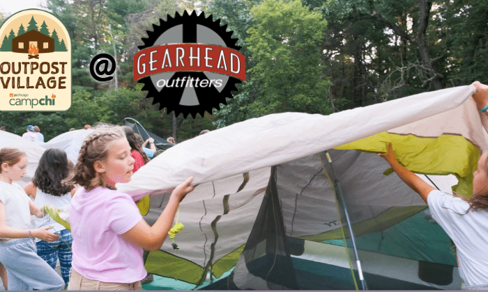 campers building tent together