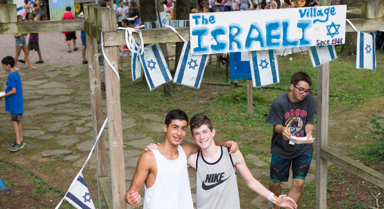 campers posing outside the Israel Village