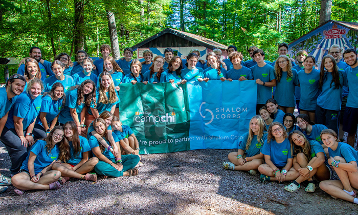 campers in front of banners