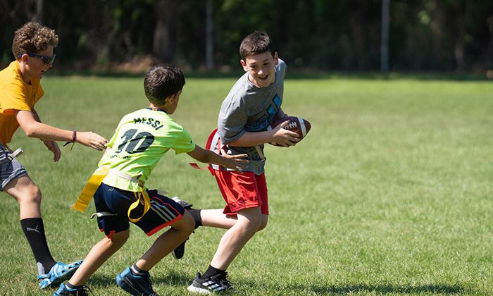 campers playing flag football