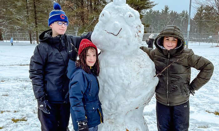 campers with snowman